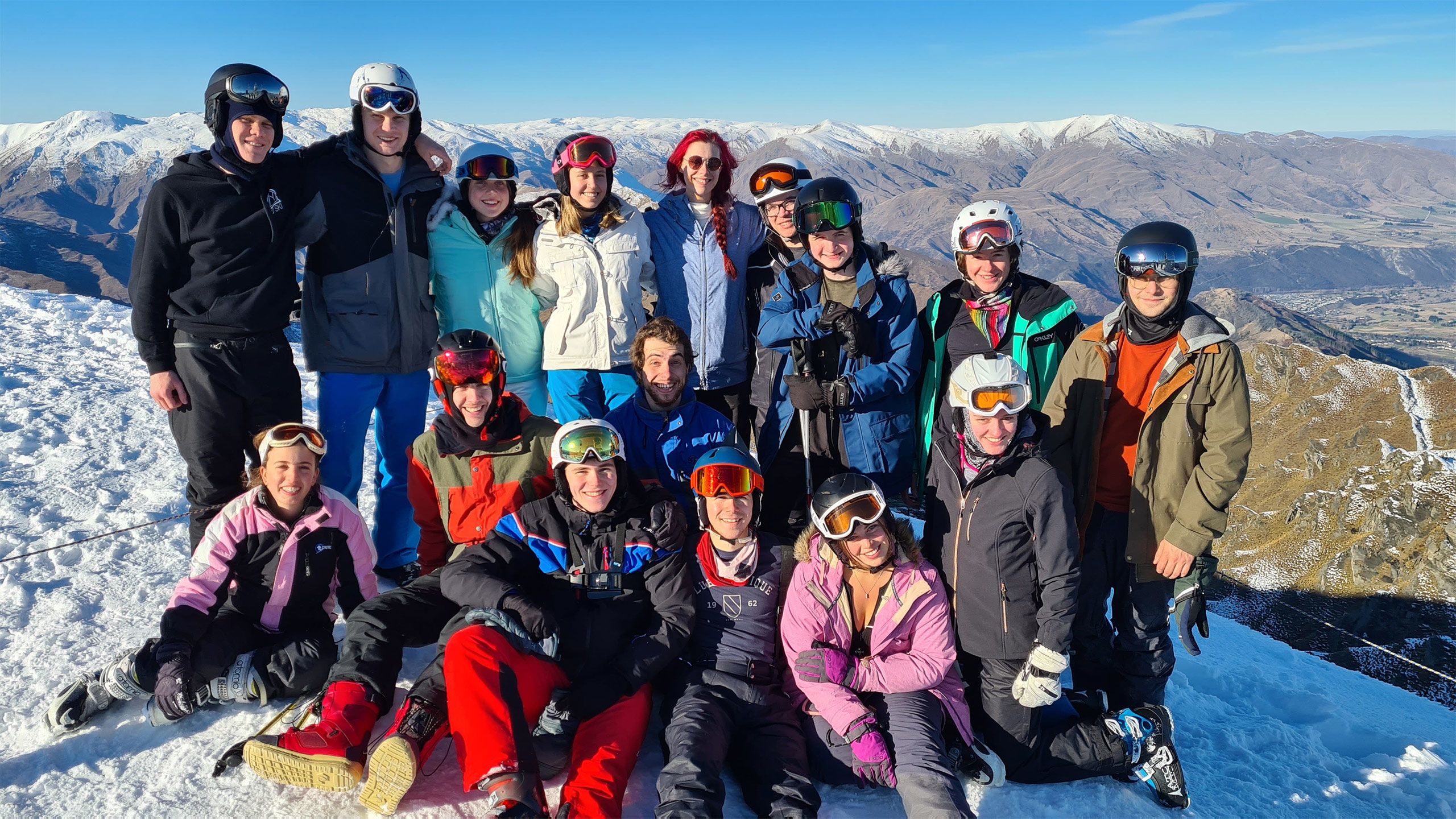 A group of skiers on a snowfield.