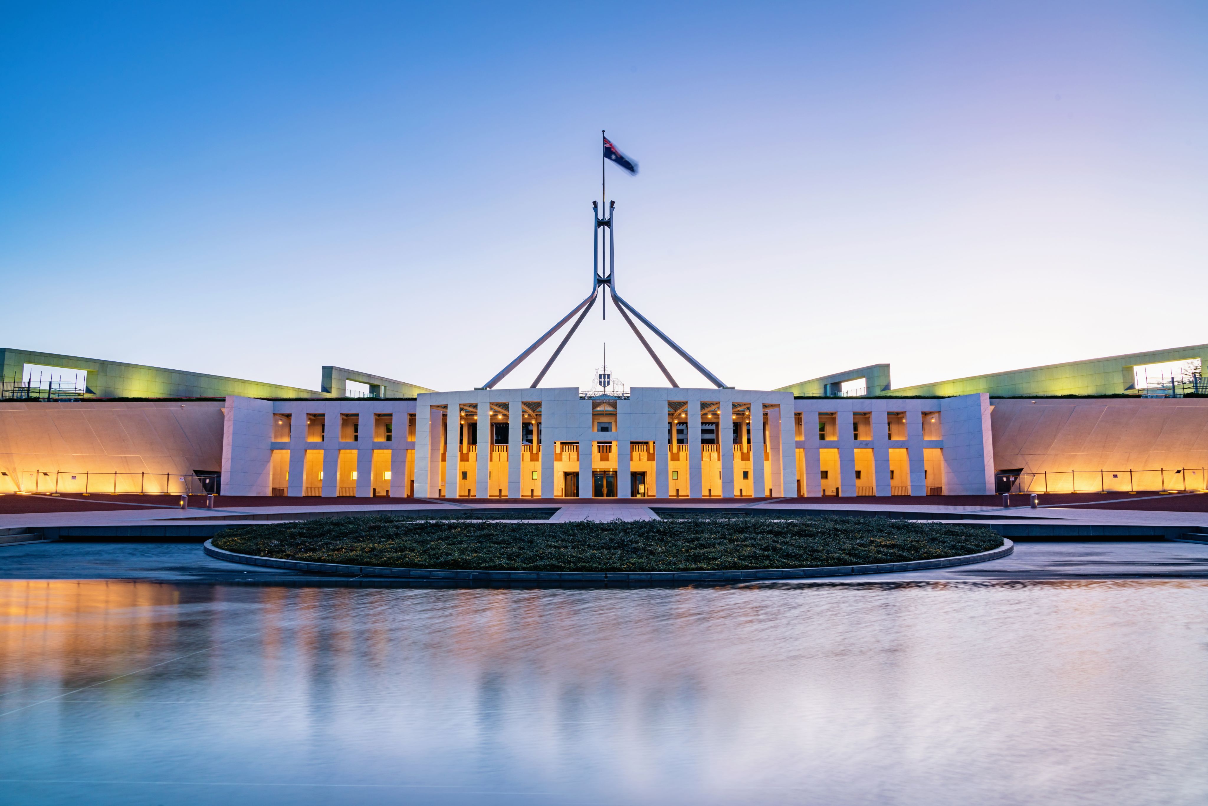 Australian Parliament House illuminated at twilight