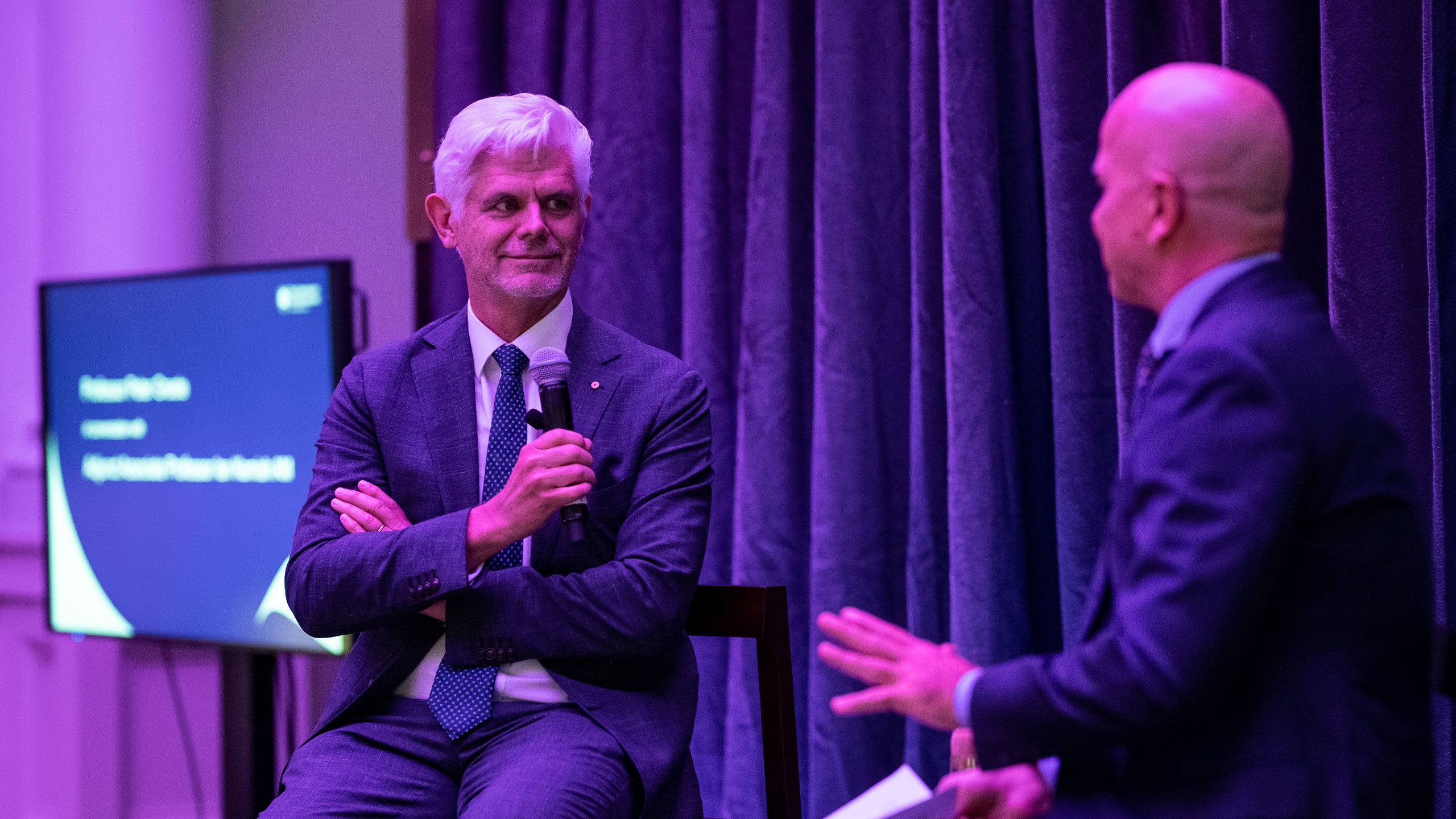 An image of UQ's Adjunct Professor Ian Kemish AM (left) is interviewed by Professor Peter Greste at the launch of Kemish's new book, The Consul.