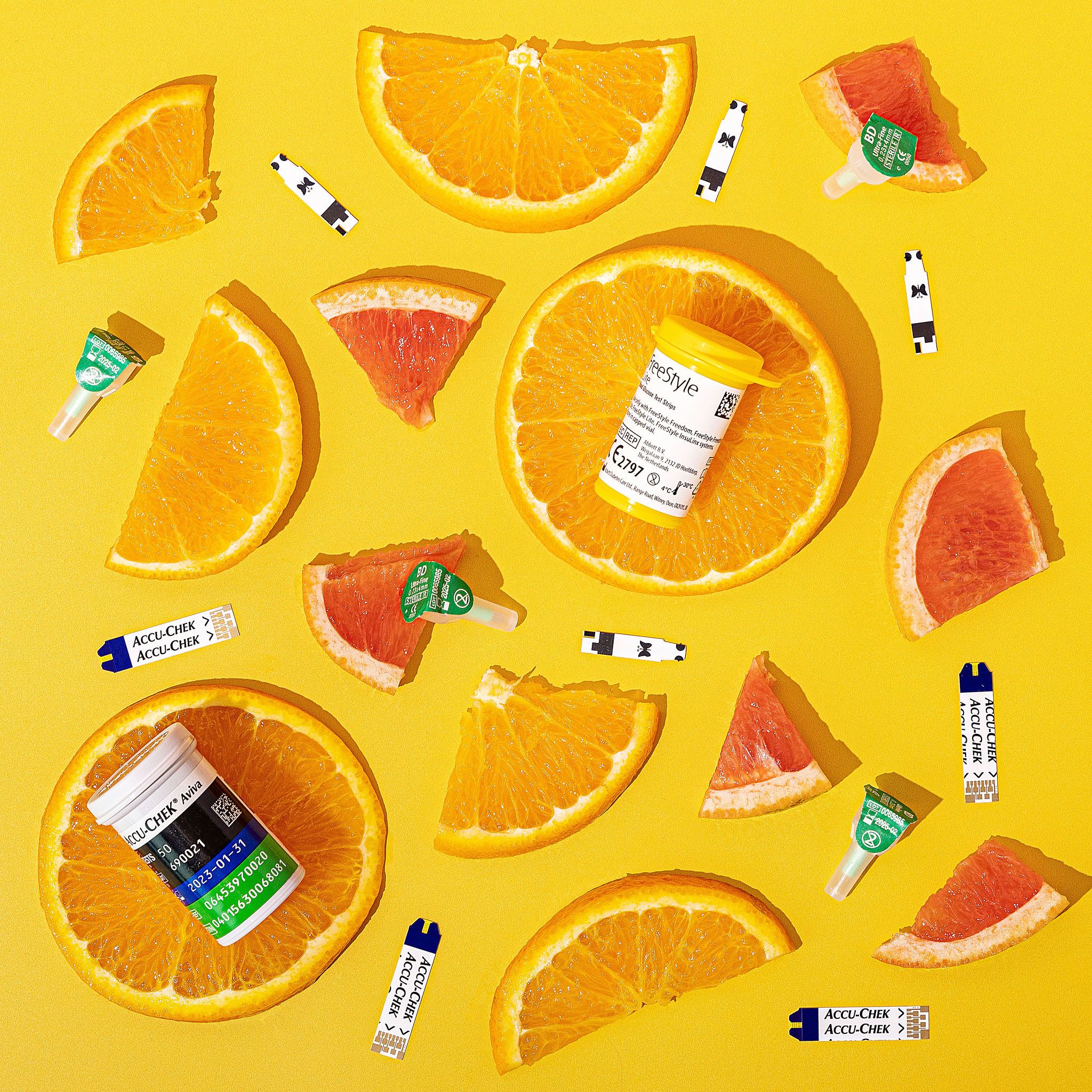 Diabetes supplies and fruit pieces