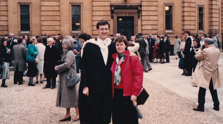 John McKenna and his wife standing at his graduation ceremony in Oxford.