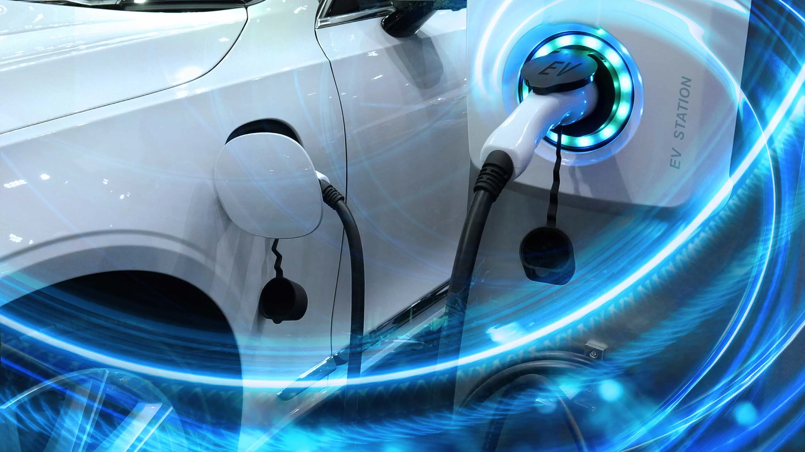 An image of an electric car plugged into a charger.