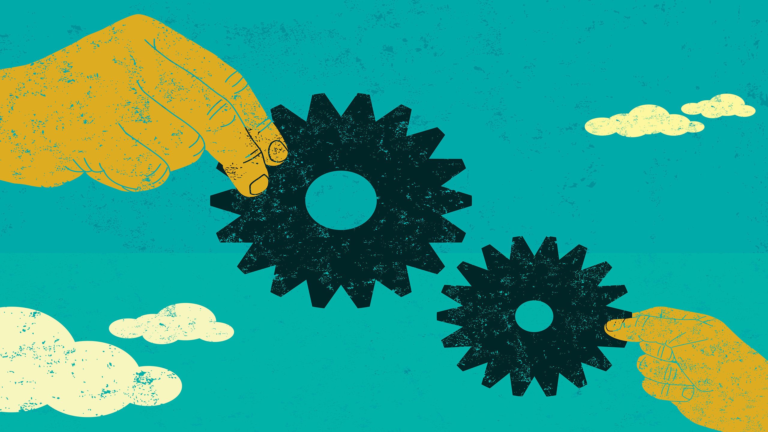 Hands holding two gears together