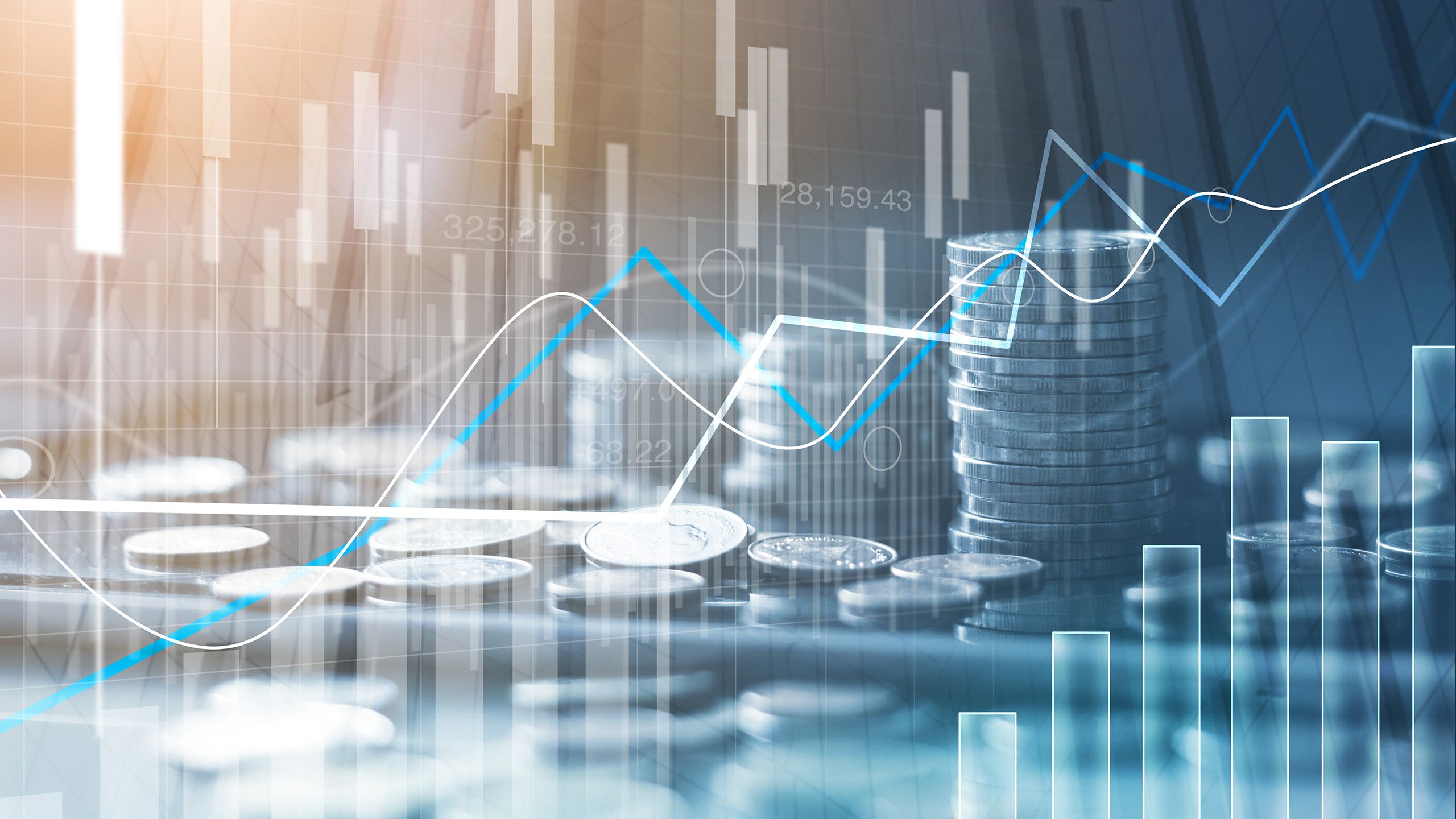 Financial stock market graph and rows of coins