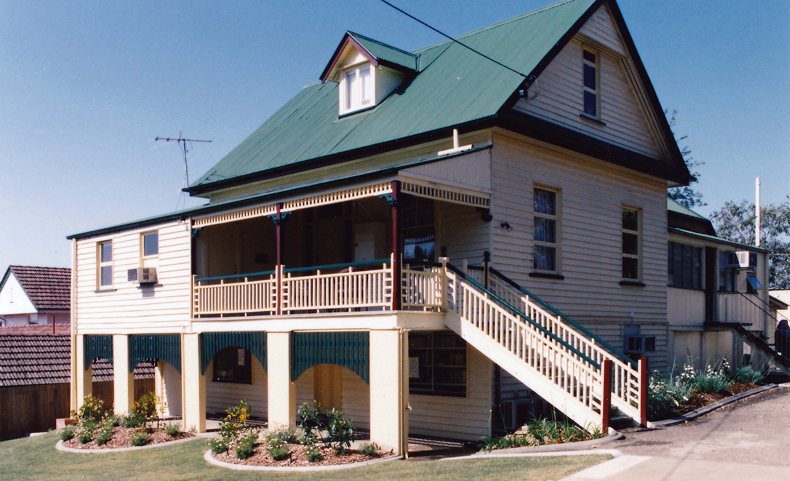 A 'Queenslander' style house on stilts with a veranda.