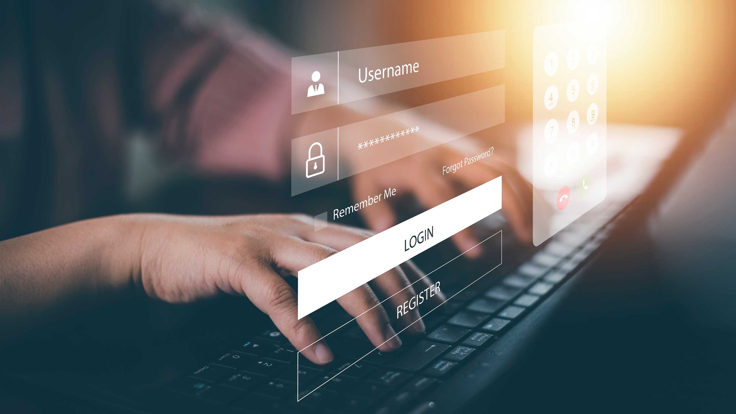 An image of hands typing and entering username and password.