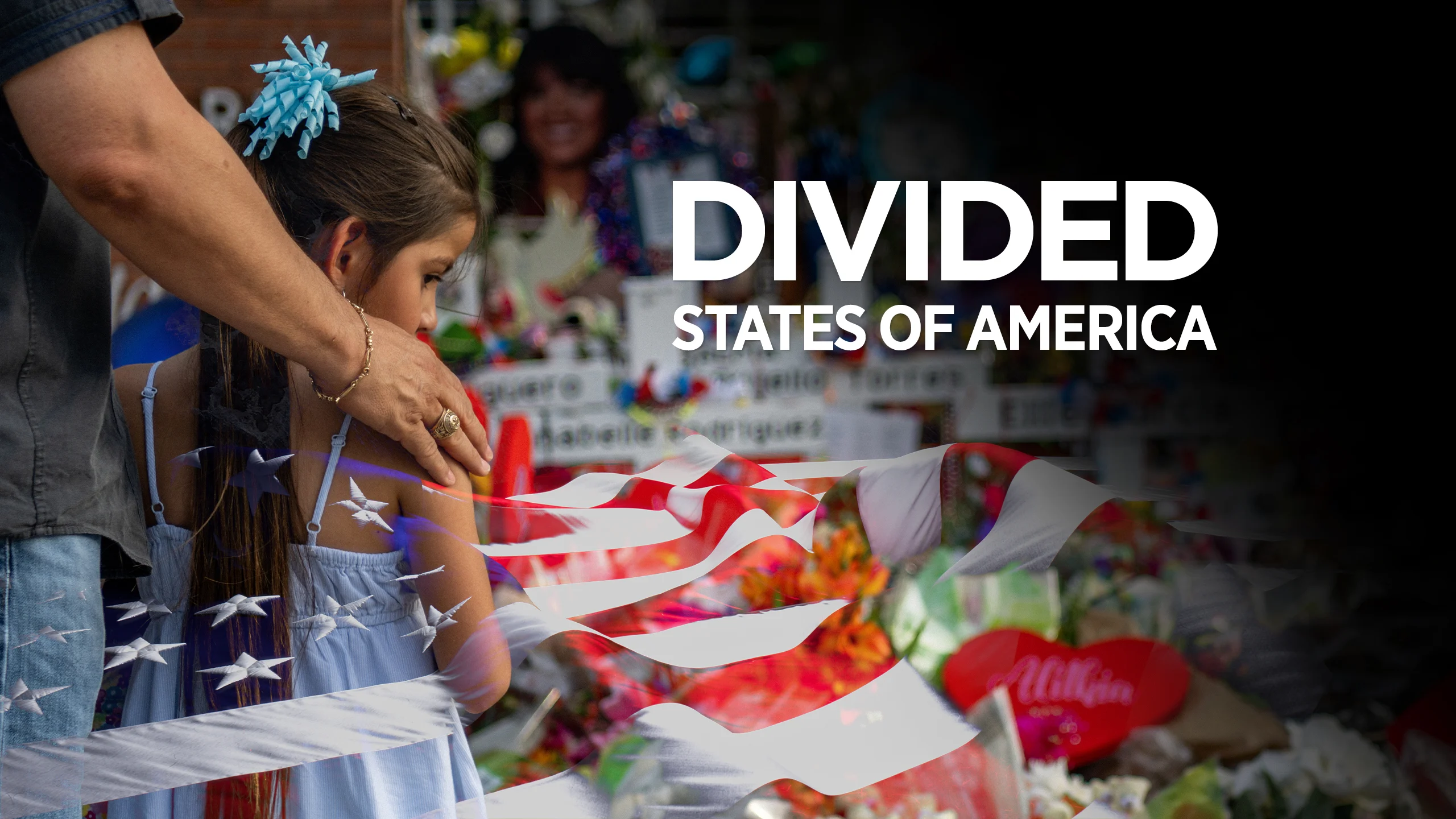 An image of a father and his daughter pay their respects at a memorial dedicated to the victims of a mass shooting at Robb Elementary School in Uvalde, Texas, on 31 May.