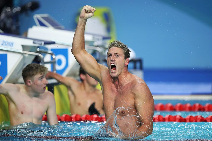 An image of UQ graduate Brenden Hall pumps his first in the air while celebrating winning gold in S9 100 metres backstroke at the Gold Coast 2018 Commonwealth Games.