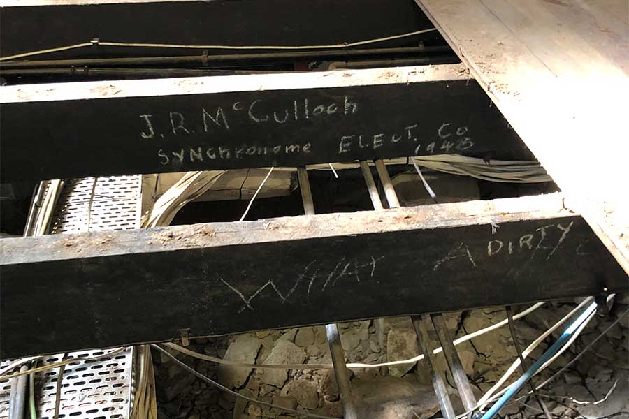 An image of some of the graffiti scribbled on the wooden boards of the building at 308 Queen Street. Image: Conrad Gargett