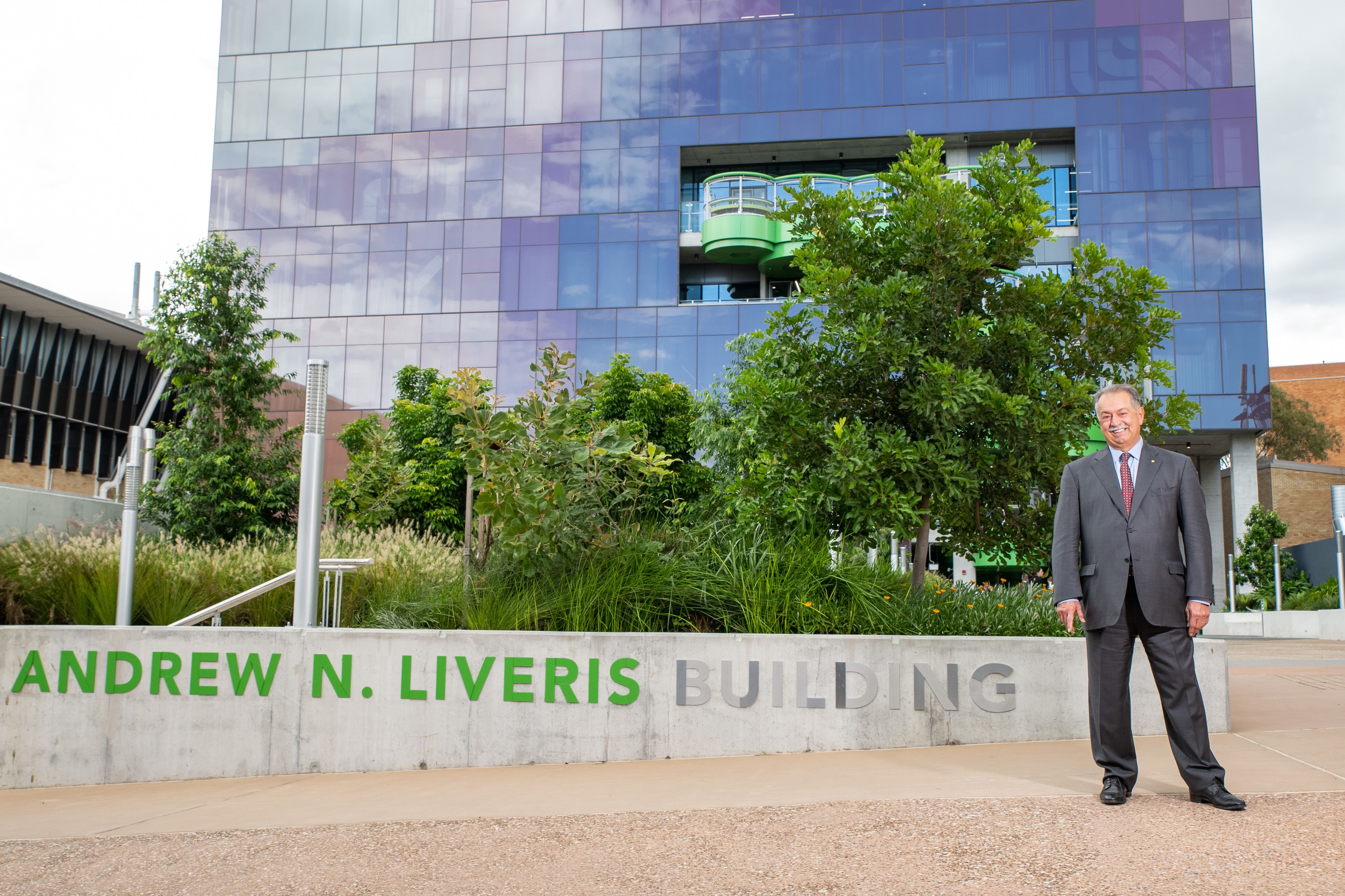 Andrew N. Liveris outside the building that bears his name