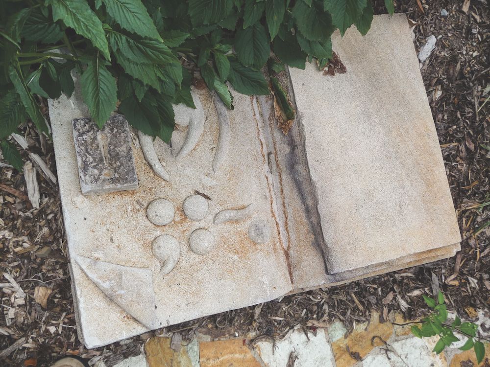 Carving of open book.