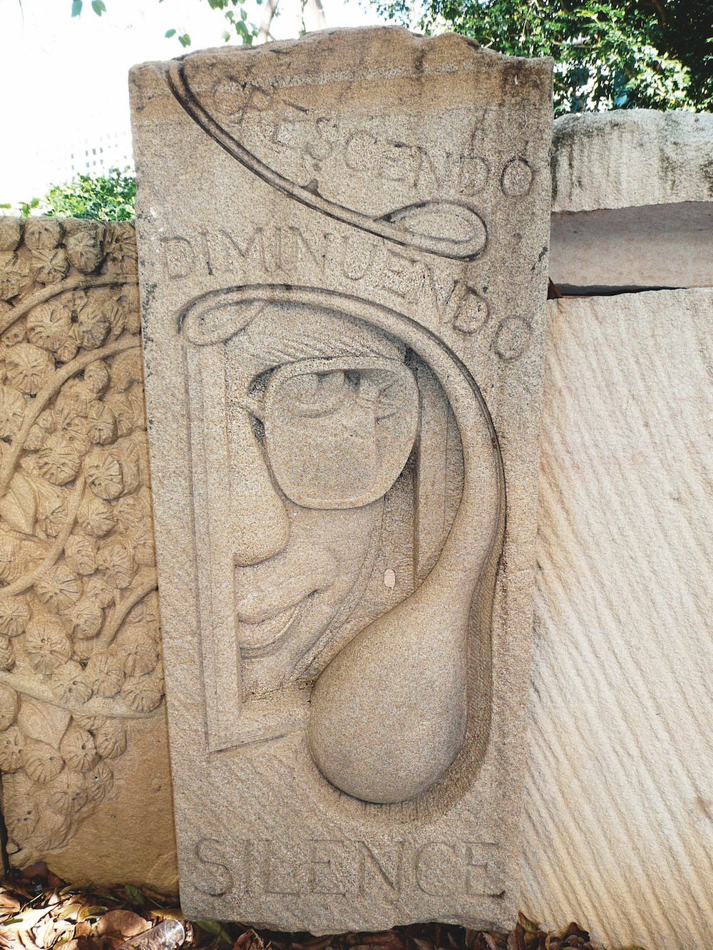 Carving of author Peter Carey,