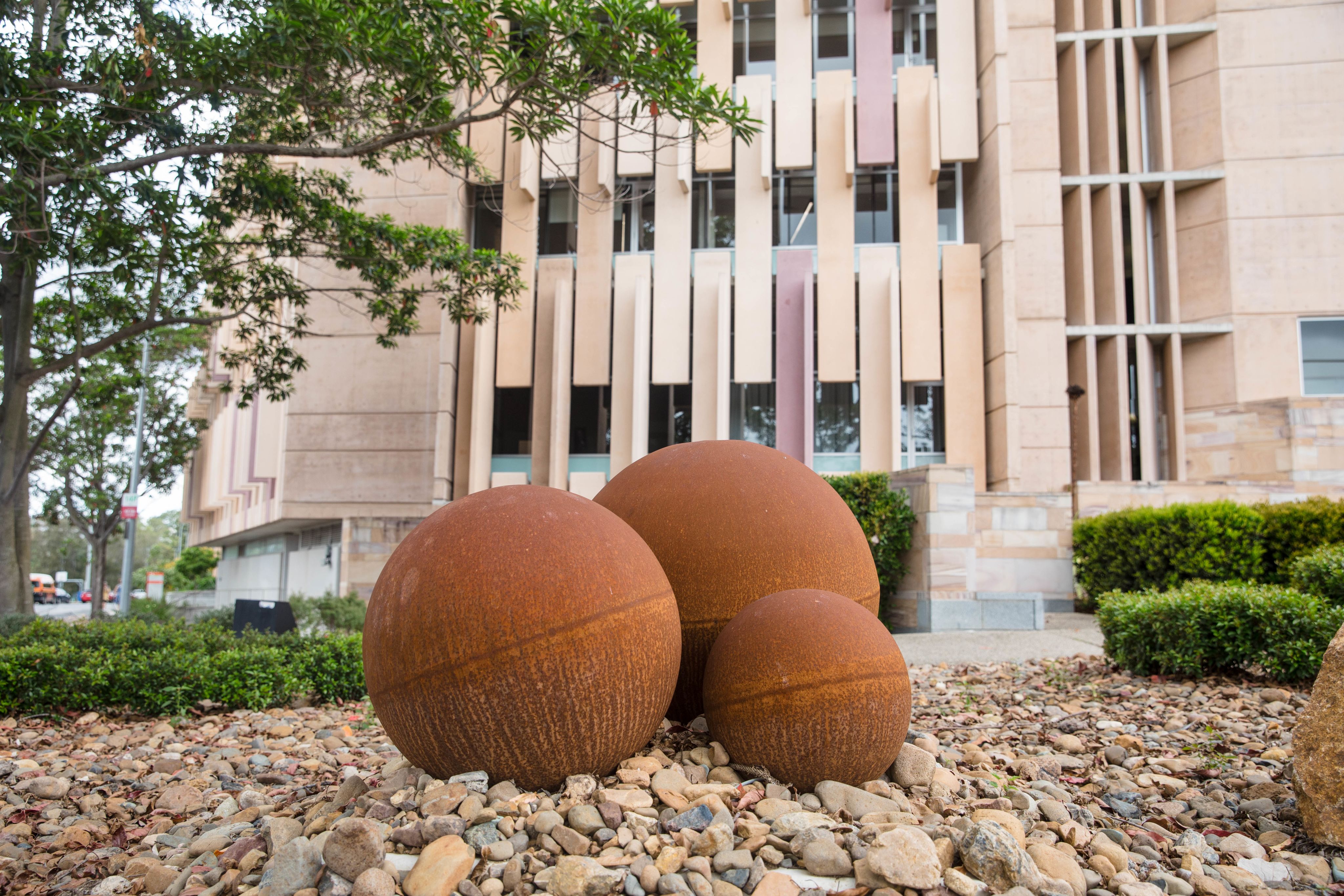 Metal sculpture of three marbles