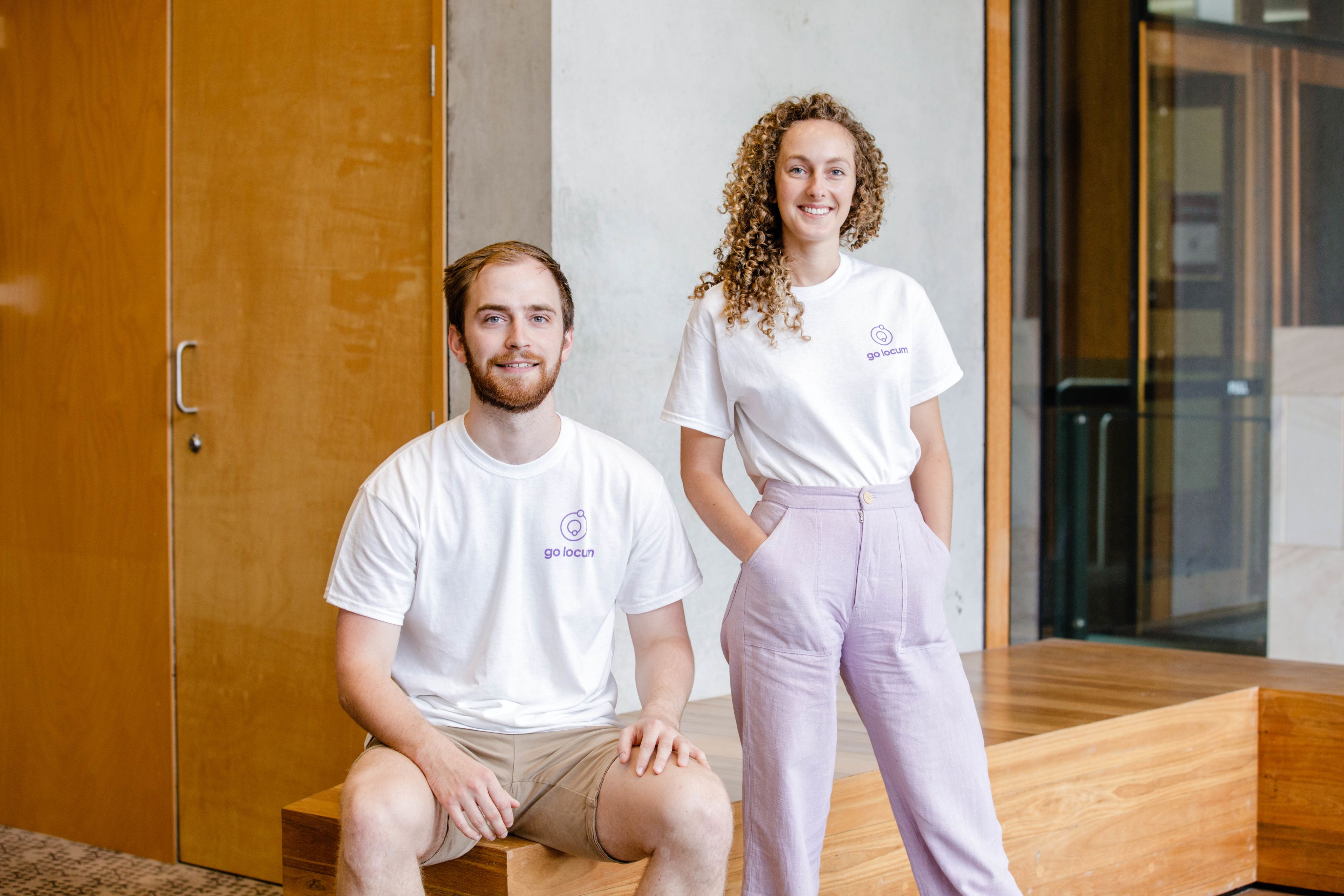 Go Locum founders, Dr Josh Case and Phoebe Bardsley wearing white t-shirts.
