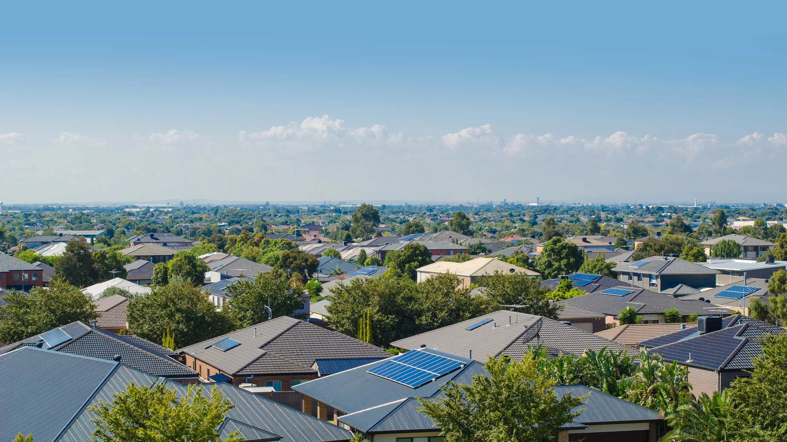 Aerial view of residential houses in an Australian suburb. Elevated view of Australian homes against blue sky.