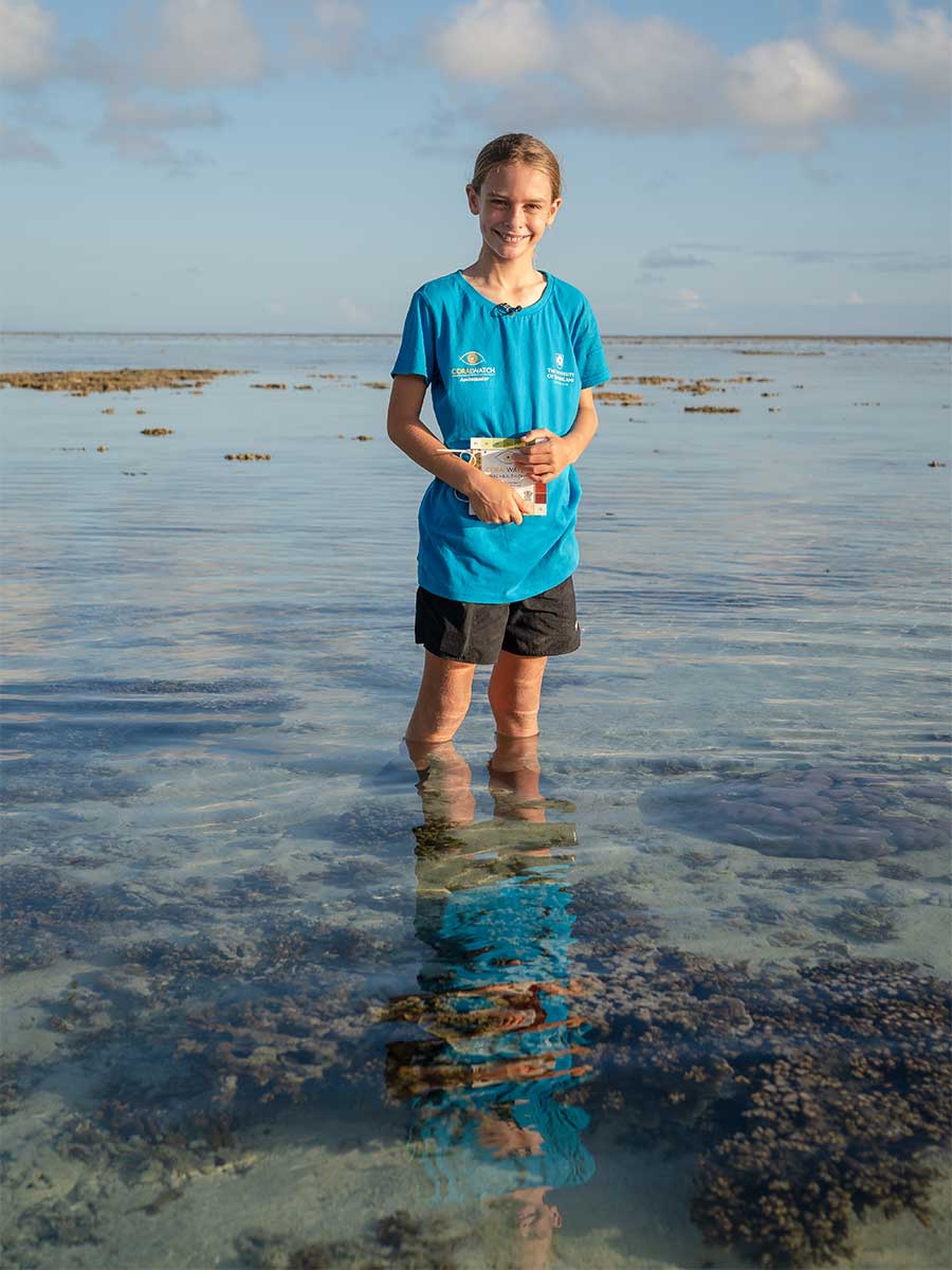 Elijah Richardson standing in the water at UQ's Heron Island Research Station.