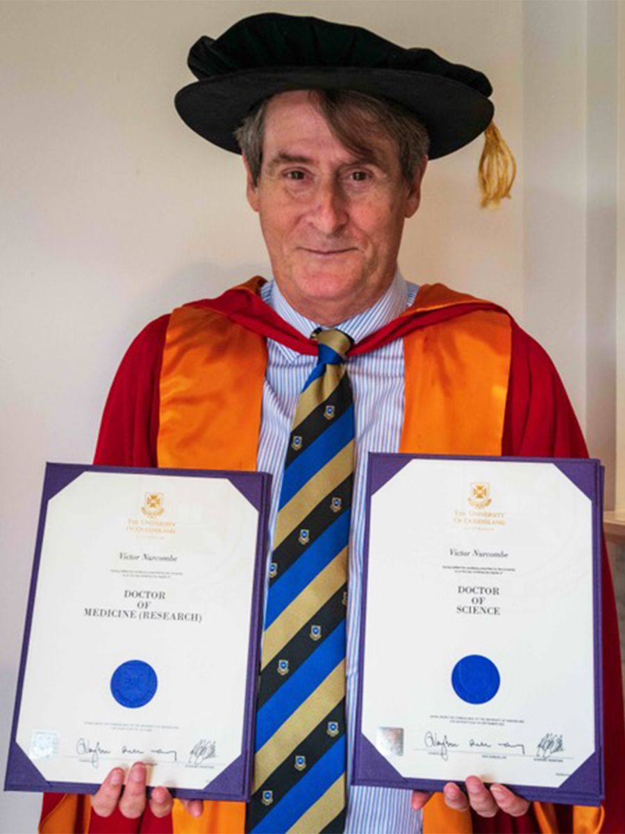 Professor Victor Nurcombe with his Doctor of Science and Doctor of Medicine (Research) degrees.