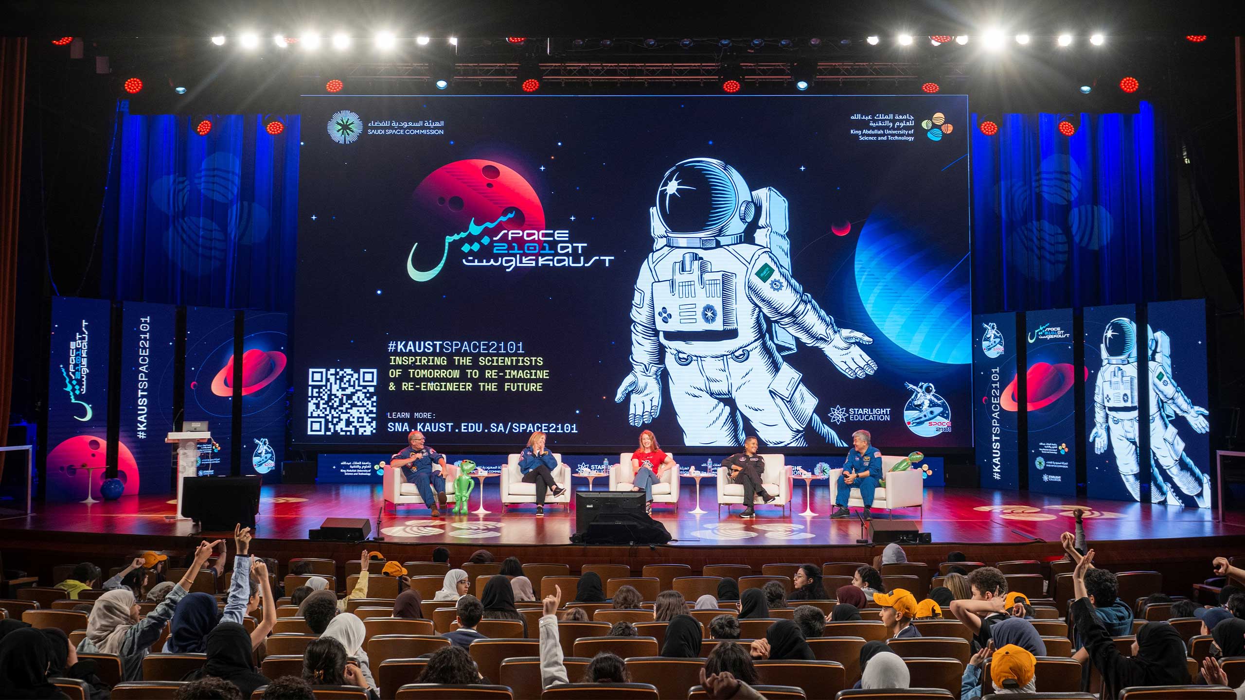 Emerald Gaydon (centre) hosting a panel interview with 4 astronauts in Saudi Arabia.