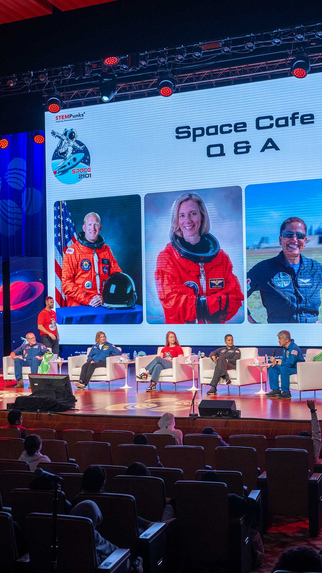 Emerald Gaydon (centre) hosting a panel interview with 4 astronauts in Saudi Arabia.