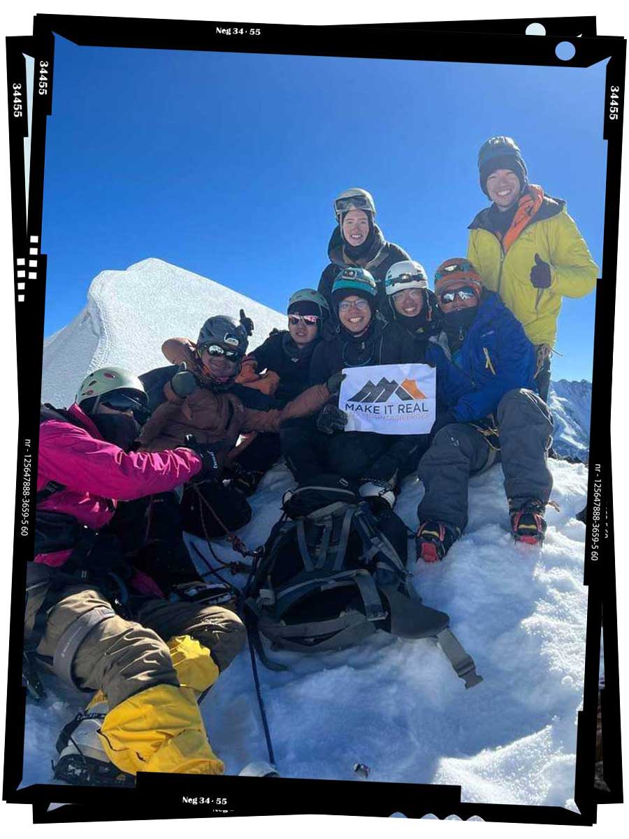 An image of Emerald Gaydon and the whole group after reaching the summit of Tsorku Peak.