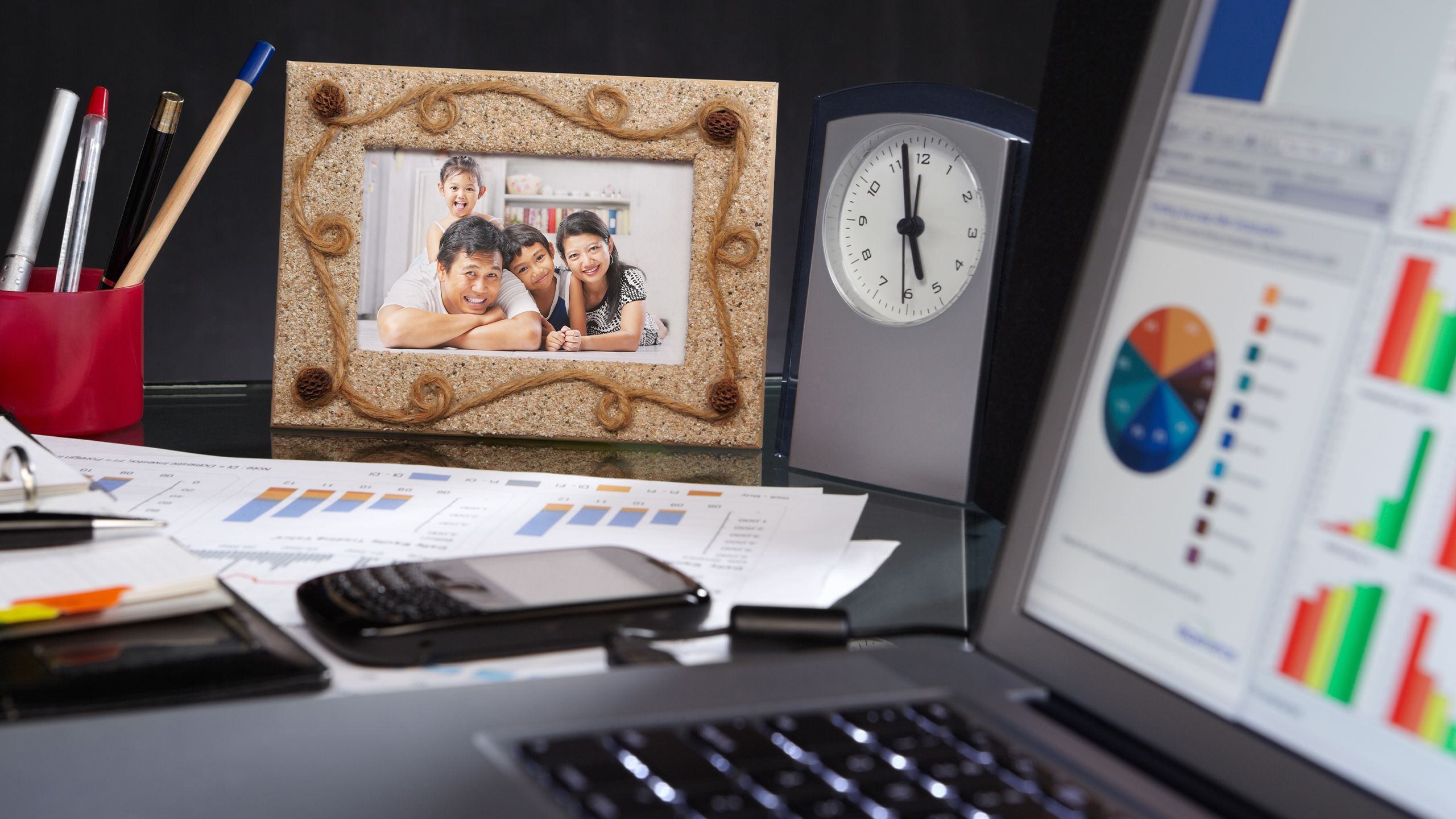 An image of a personal family photo on an office desk.