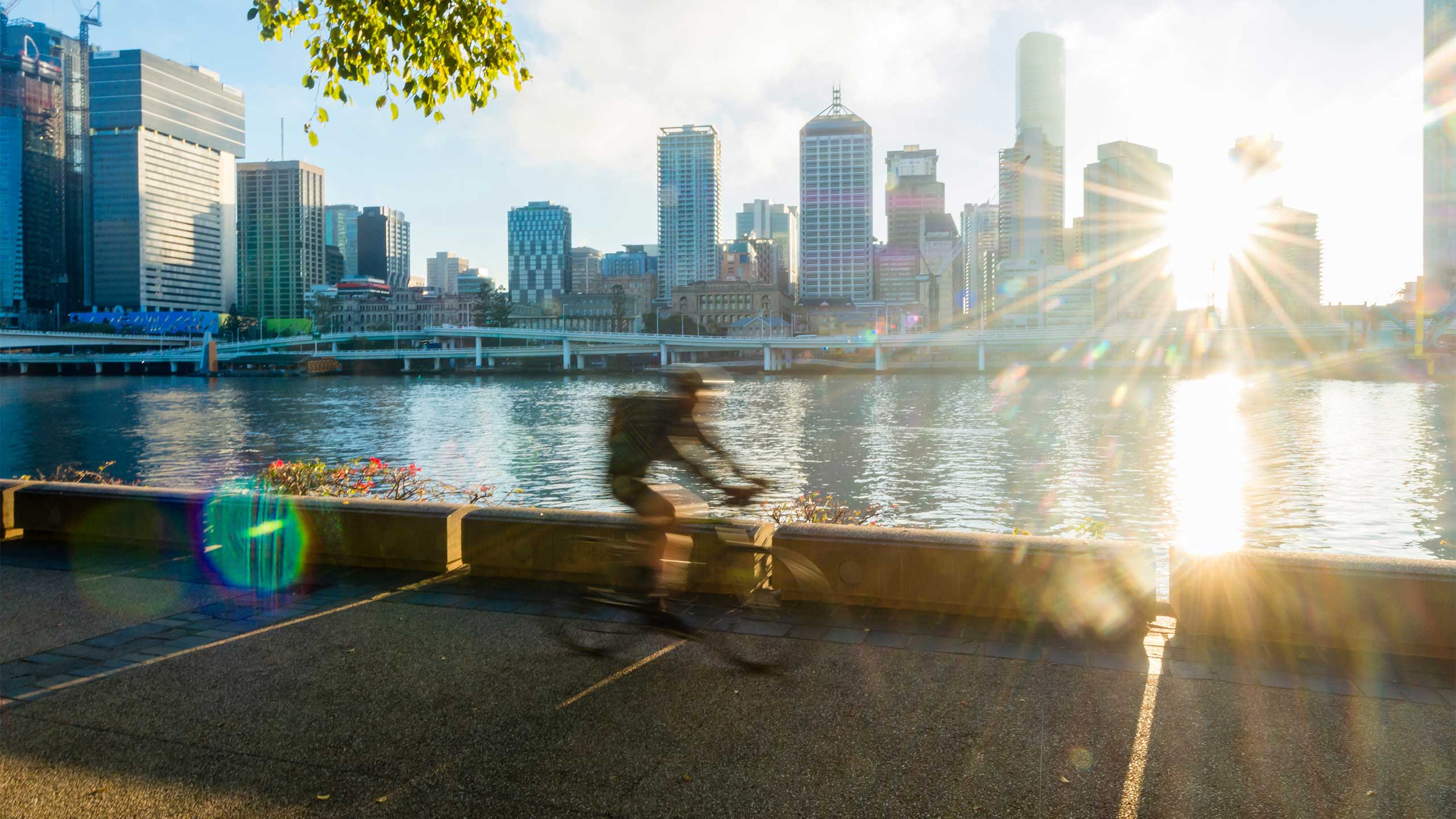 Cyclist riding along South Bank, Brisbane.