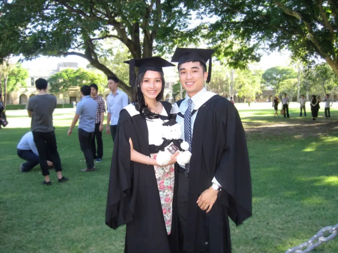 An image of Esther and Miguel in UQ's Great Court on their graduation day.