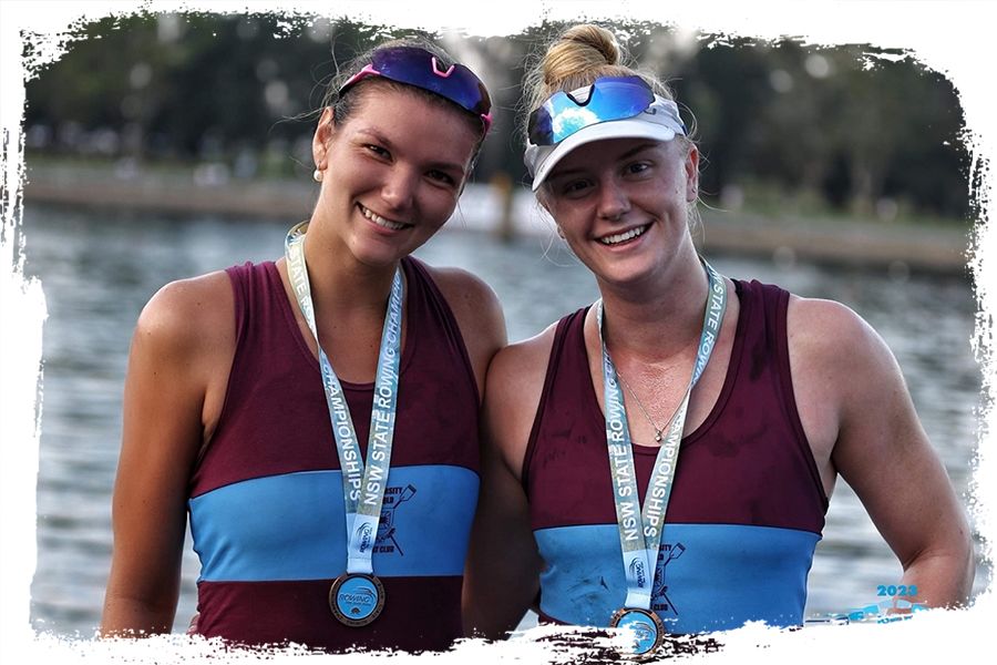 UQBC teammates Phoebe Robinson and Lucy Hope.