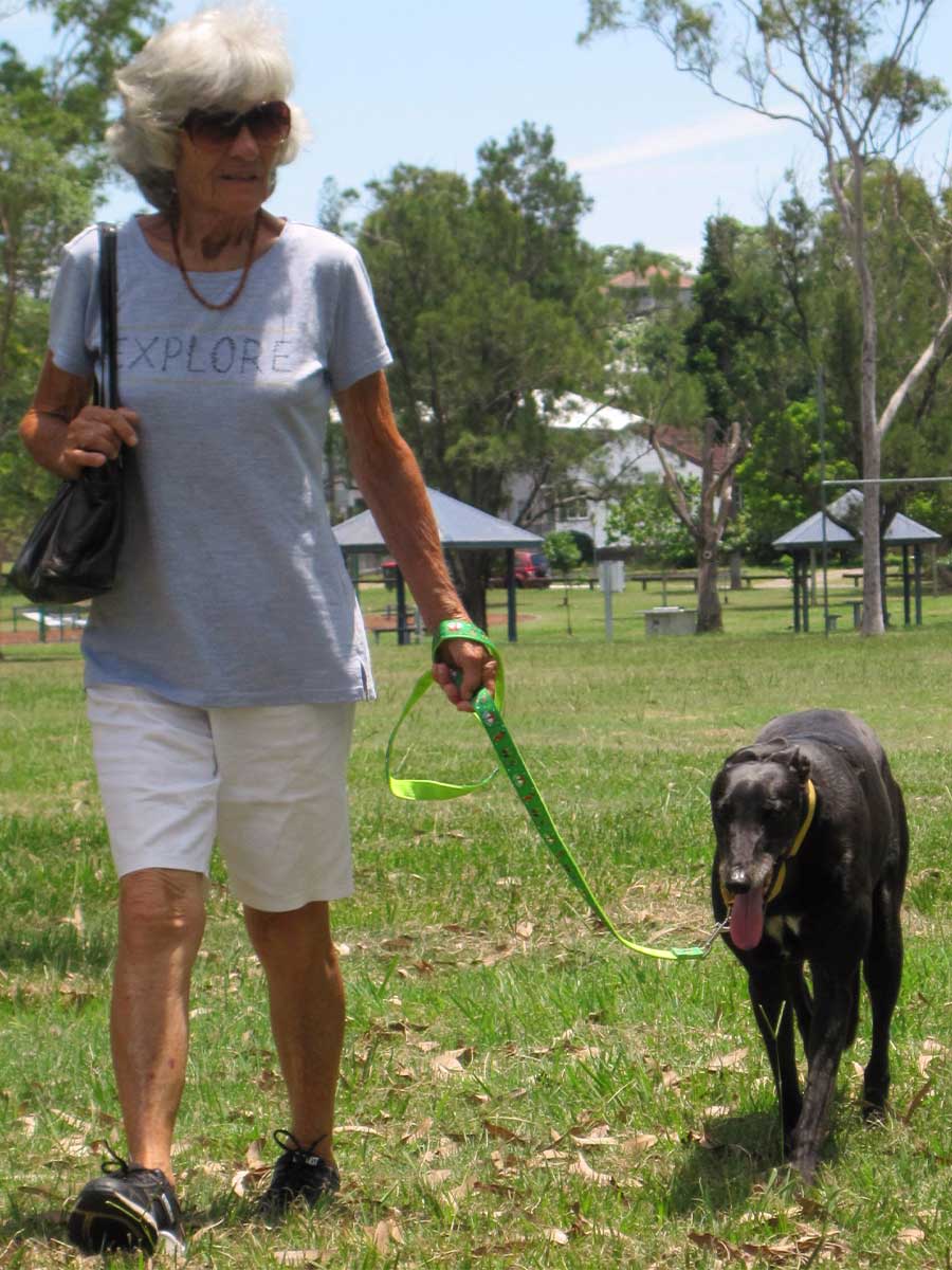An image of Ann Copsey walking Marcie in a park.