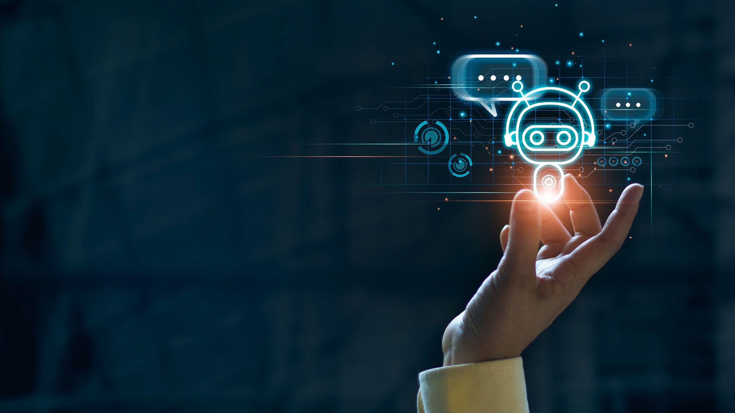 A human hand with a digital graphic of a robot with speech bubbles surrounding it