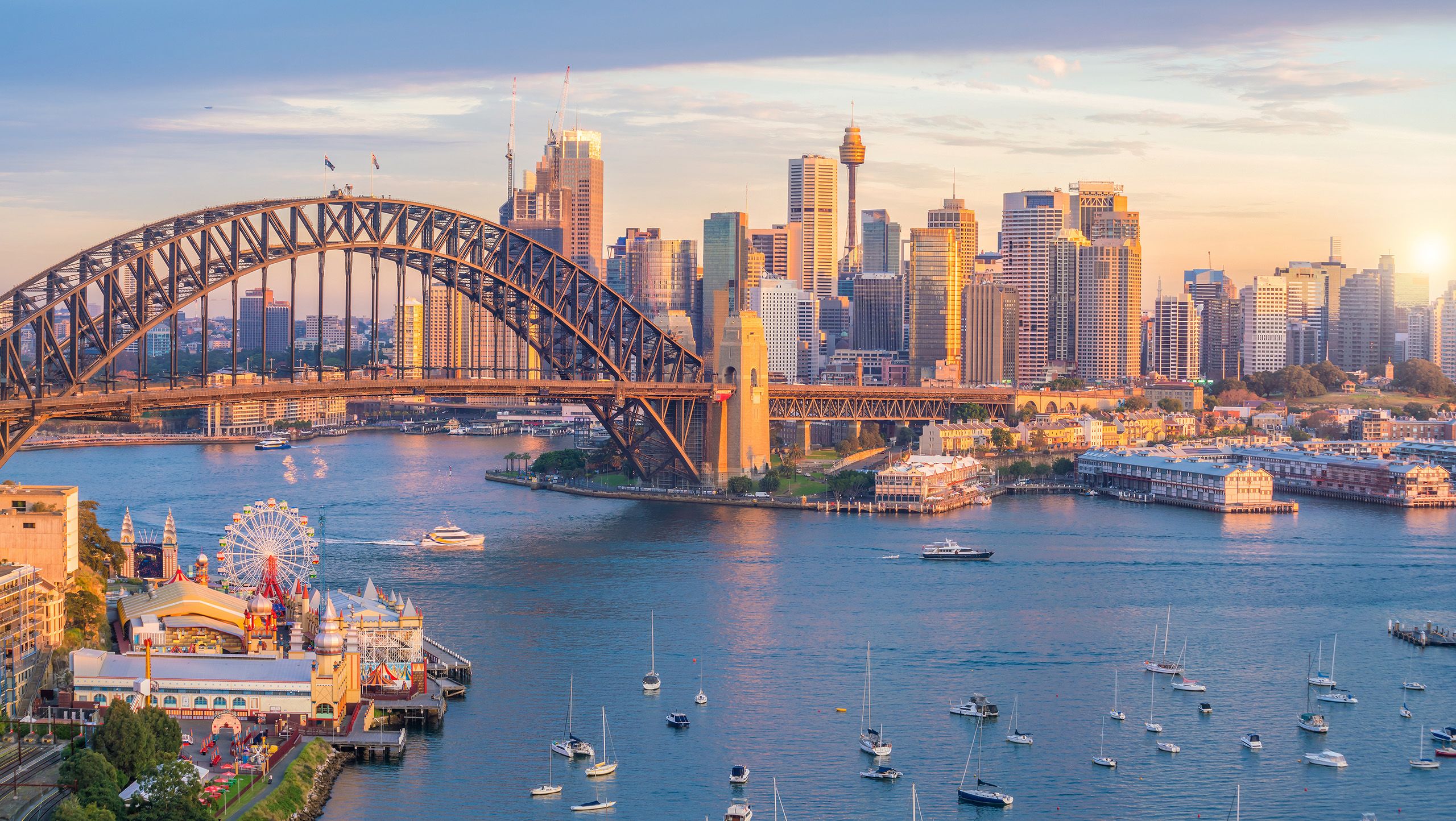 The Sydney harbour and skyline, including the Sydney Harbour Bridge and Luna Park