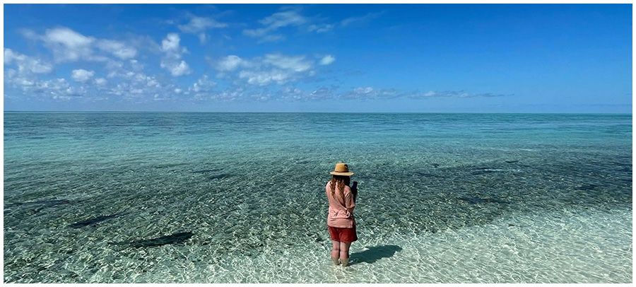 Kimberley Shaw standing in the water off Heron Island