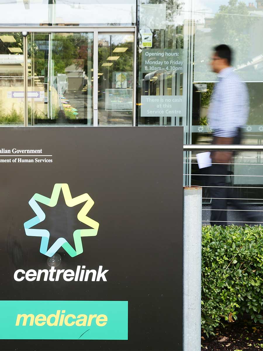 A man walks into a Medicare and Centrelink office.