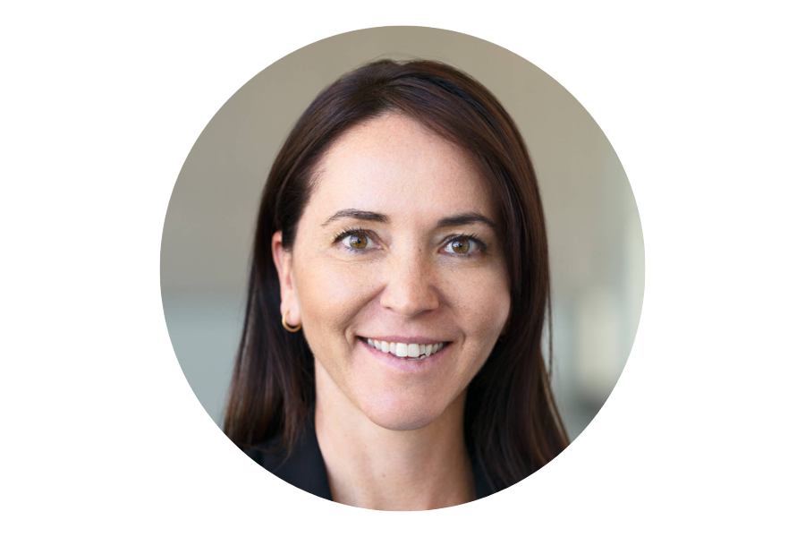 Photo of a woman with brown hair and brown eyes, smiling
