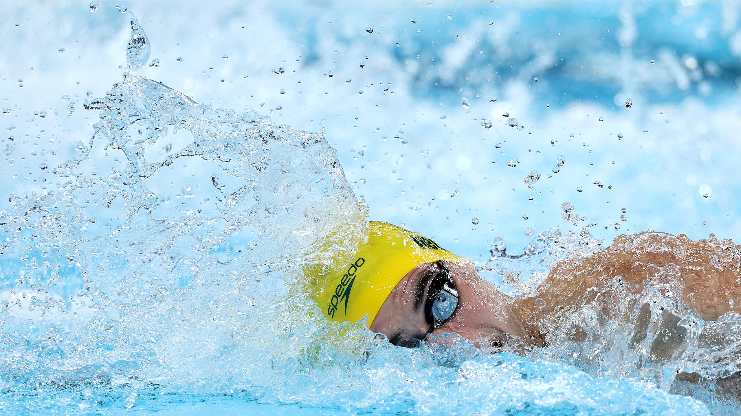 UQ student Thomas Neill in the pool during the 4x200 metres freestyle relay final.