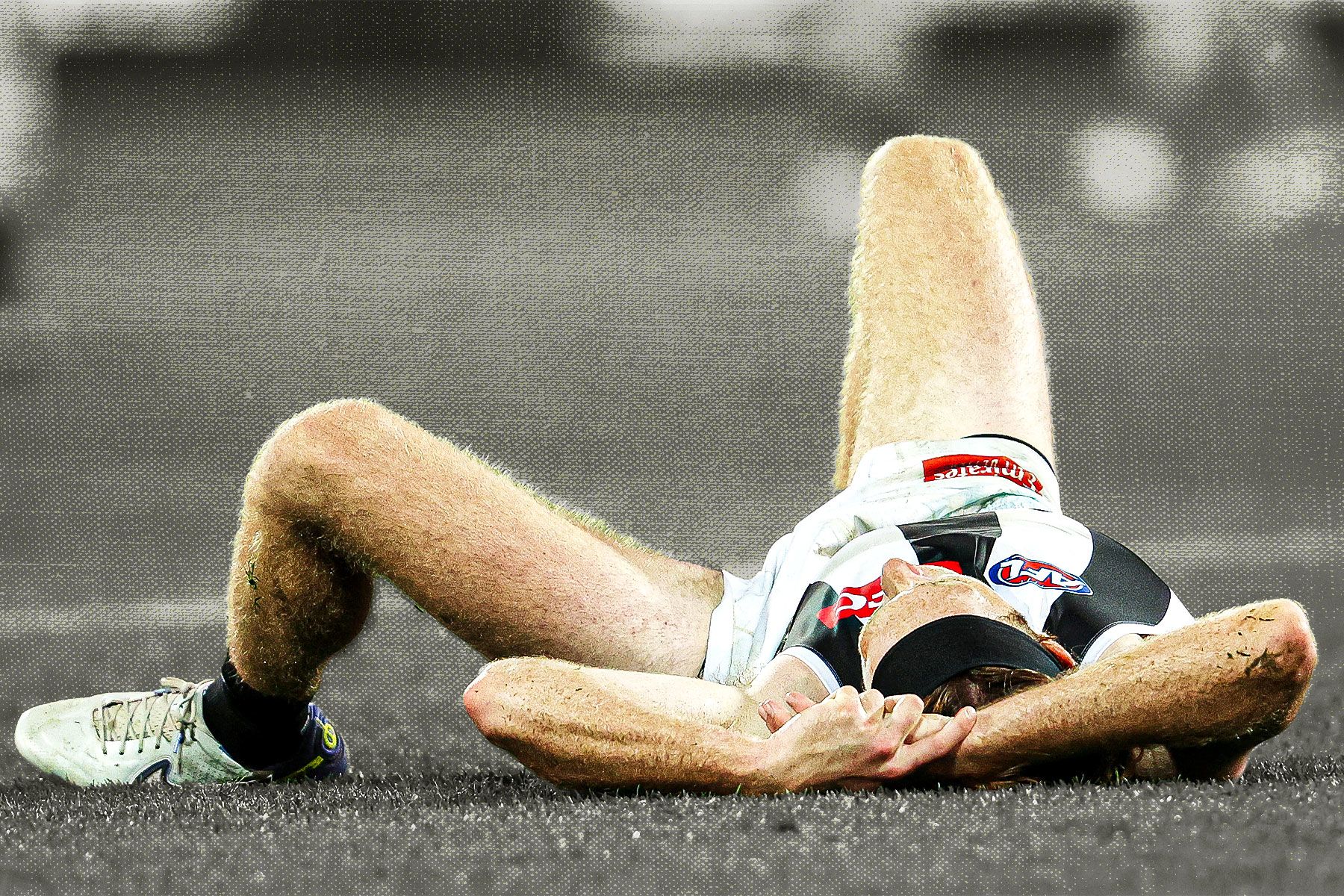 Nathan Murphy on the ground after a head knock against Adelaide in 2023.