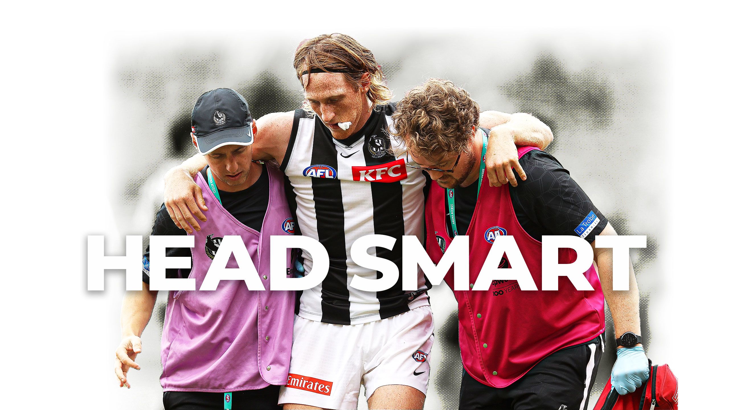 Head smart: Collingwood defender Nathan Murphy is helped from field after suffering concussion.
