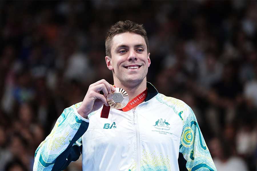 Jack Ireland on the podium with his bronze medal after the men's S14 200m freestyle. Image: Adam Davy/PA Images via Getty Images