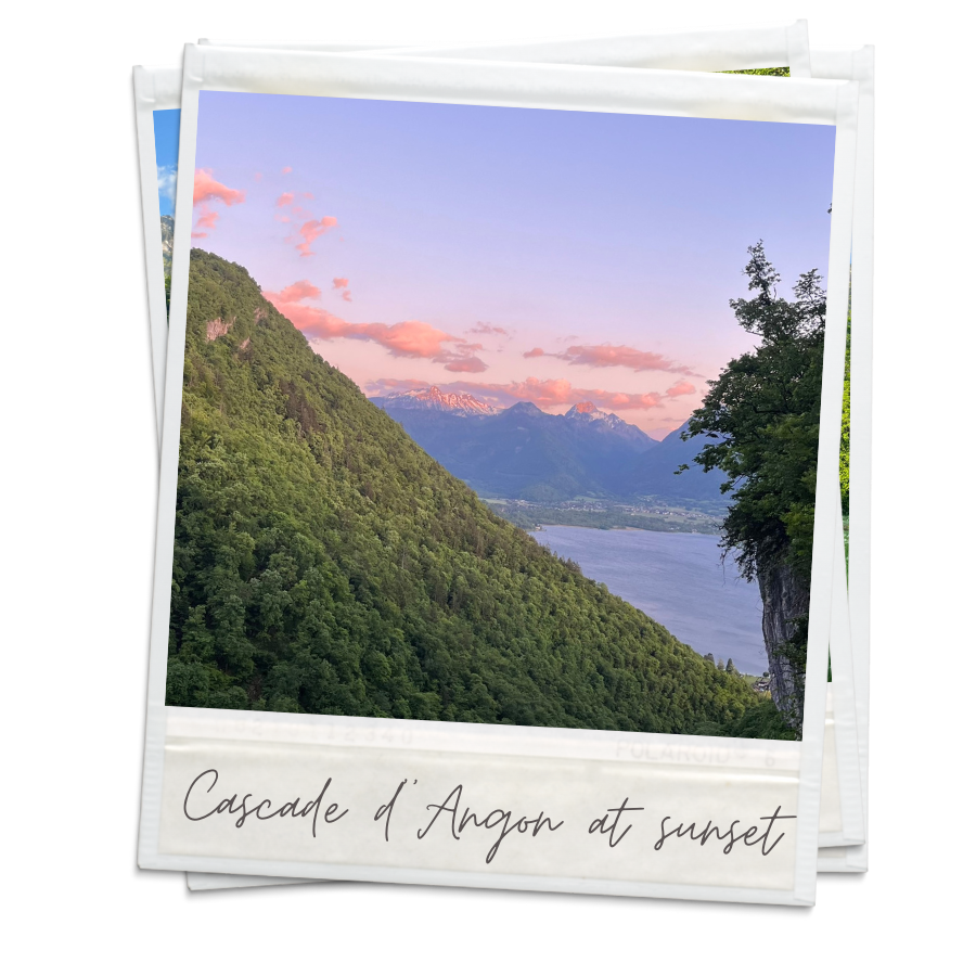 A polaroid of the Cascade d'Angon at sunset. The pink and purple dusty sky is peaking out from behind the side of the mountain.