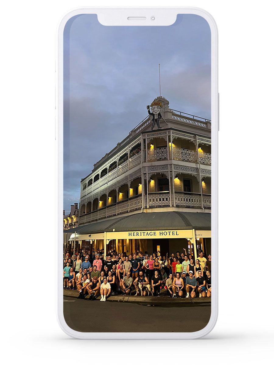 A large group of runners gather outside the Heritage Hotel in Rockhampton before Run and Rump.