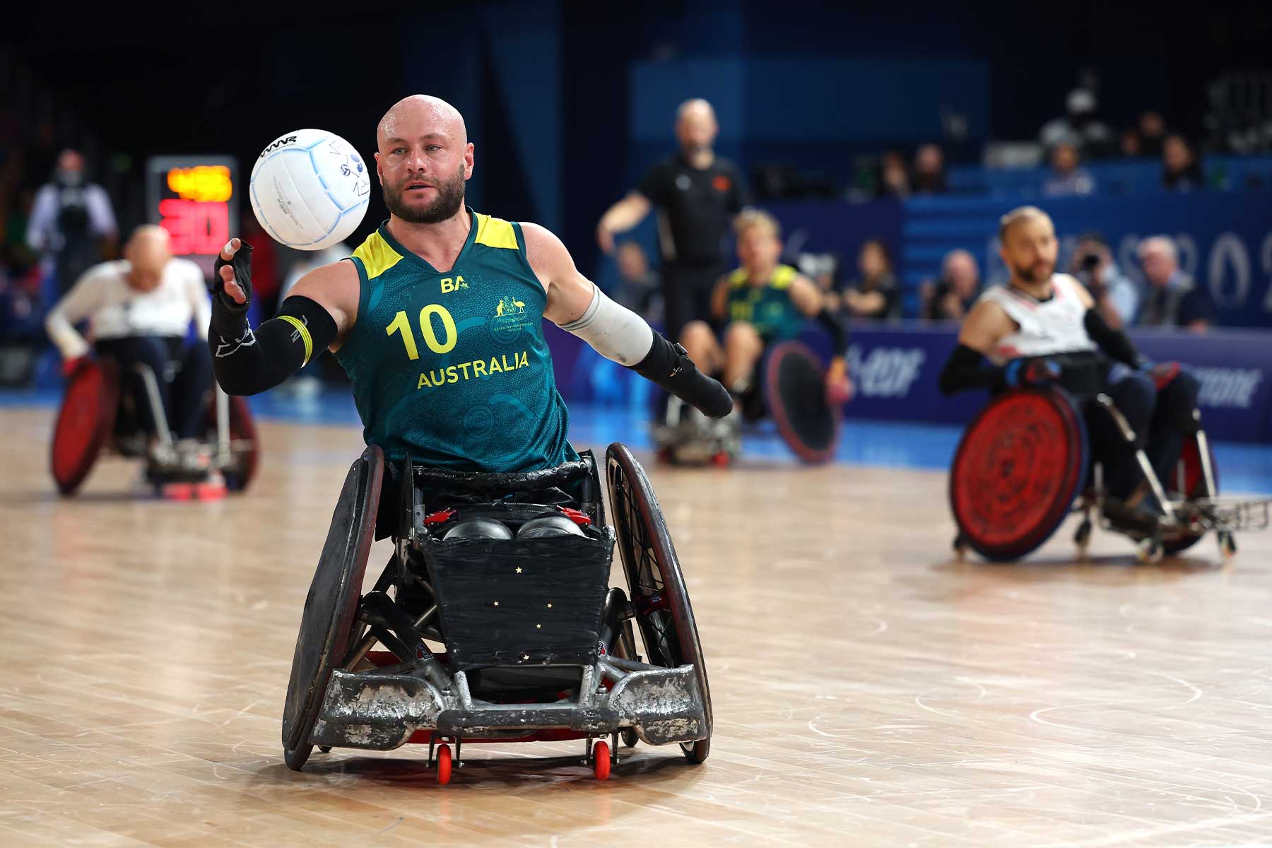 Australian and UQ Wheelchair Rugby Club player Chris Bond in action against Great Britain.