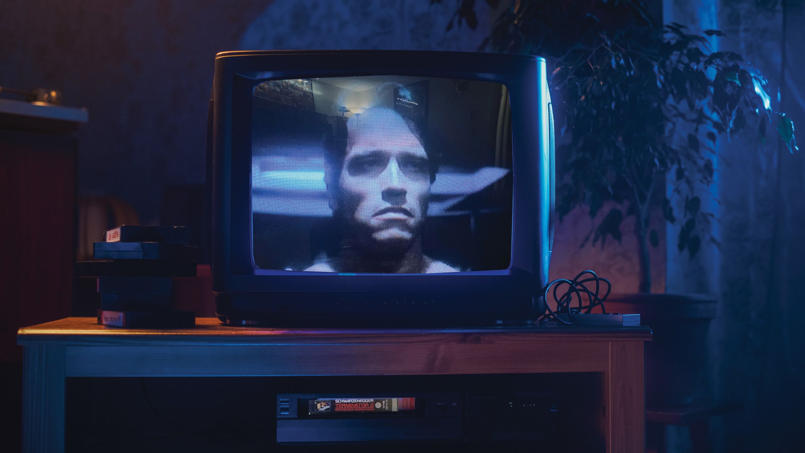 Close Up Footage of a Retro TV Set Screen with an screenshot of The Terminator from the film