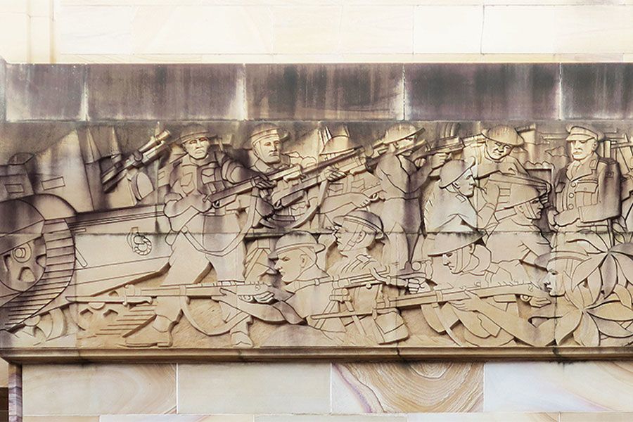 A carving on the Forgan Smith tower – Australia: 1939–1945 frieze outside – evoking the Anzac spirit to this day.