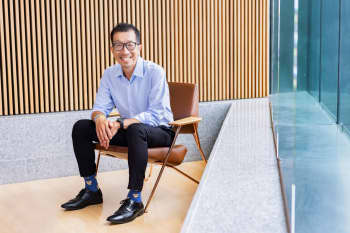 Professor Danny Liew sitting on a chair