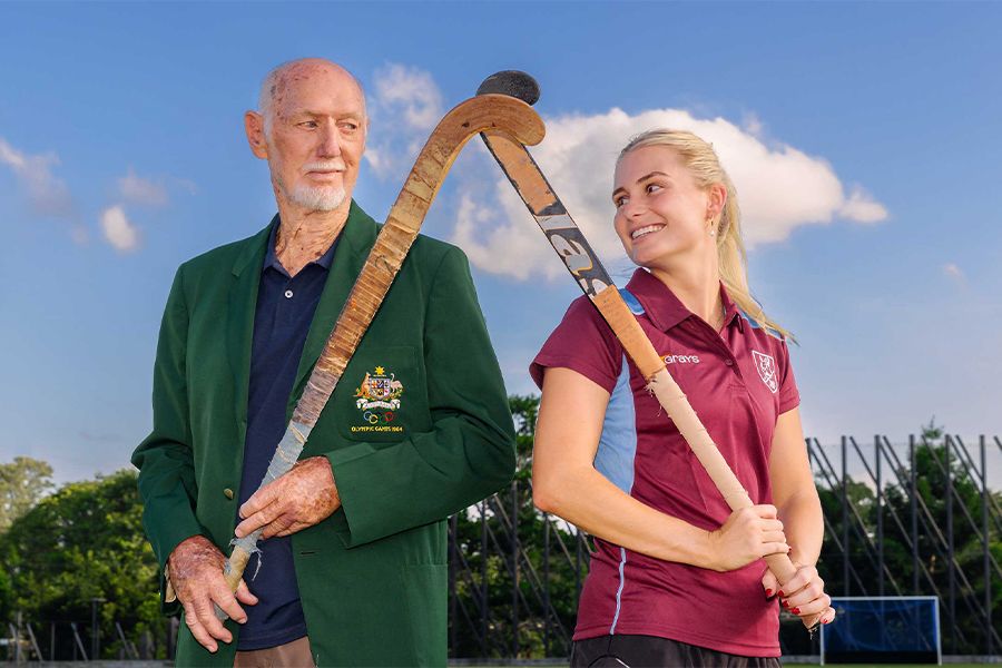 Australian represeHockey Australia Hall of Famer Don McWatters with UQ Hockey Club women's captain Morgan Gallagher.