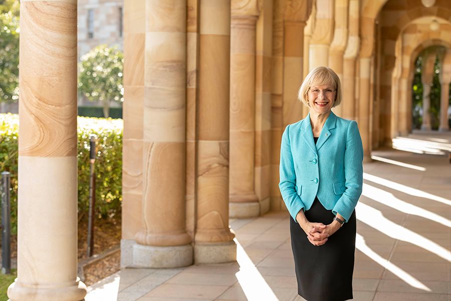 Professor Deborah Terry in front of sandstone columns