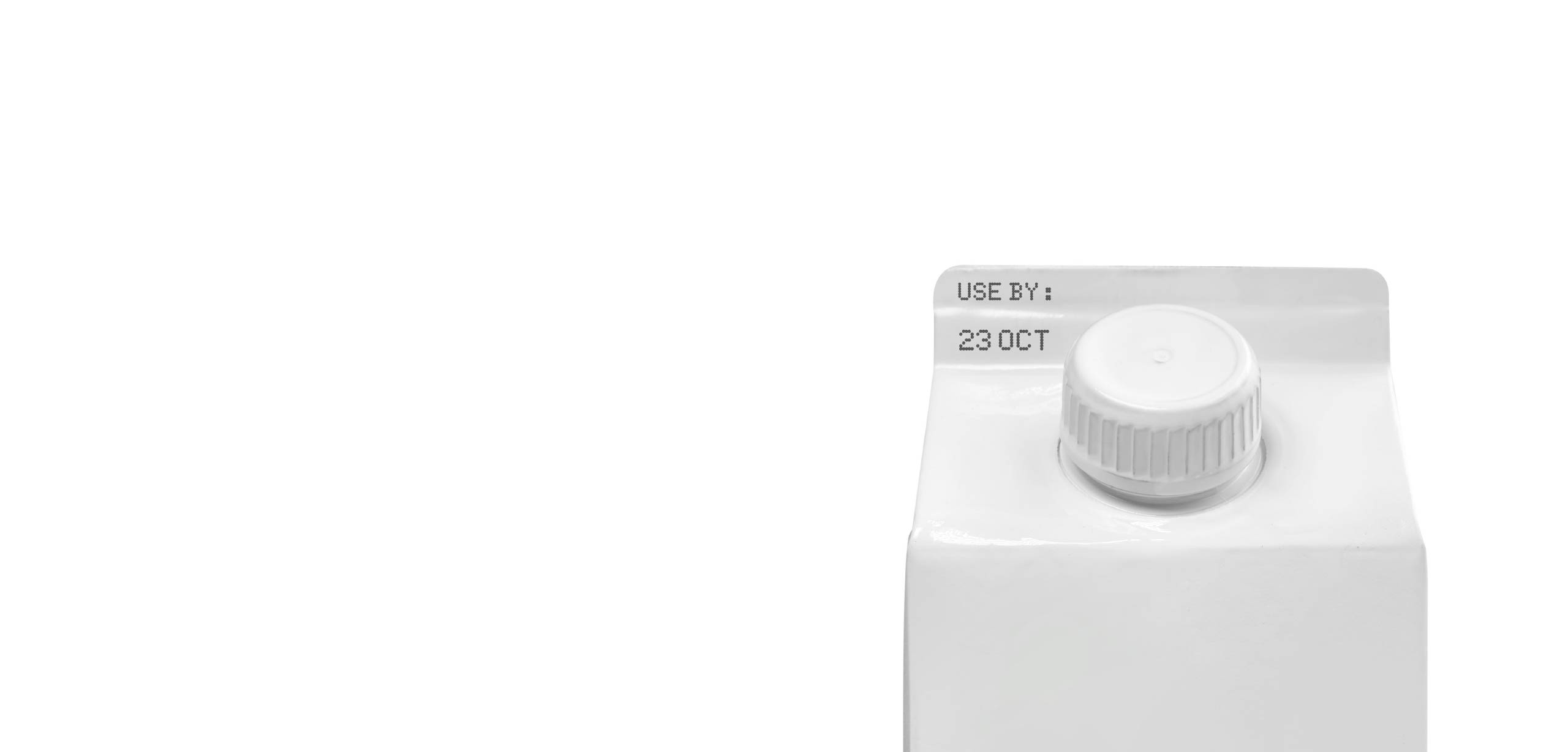 A close up image of a milk carton with an expiration date of 23 October