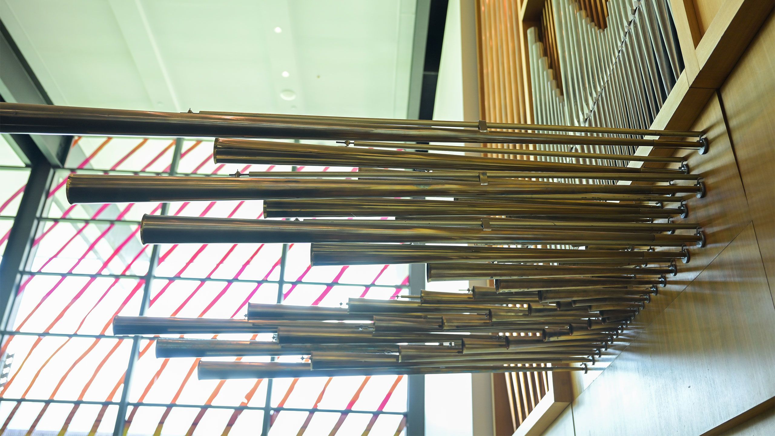 A close up of the horizontal pipes of the UQ pipe organ inside the UQ Art Museum.