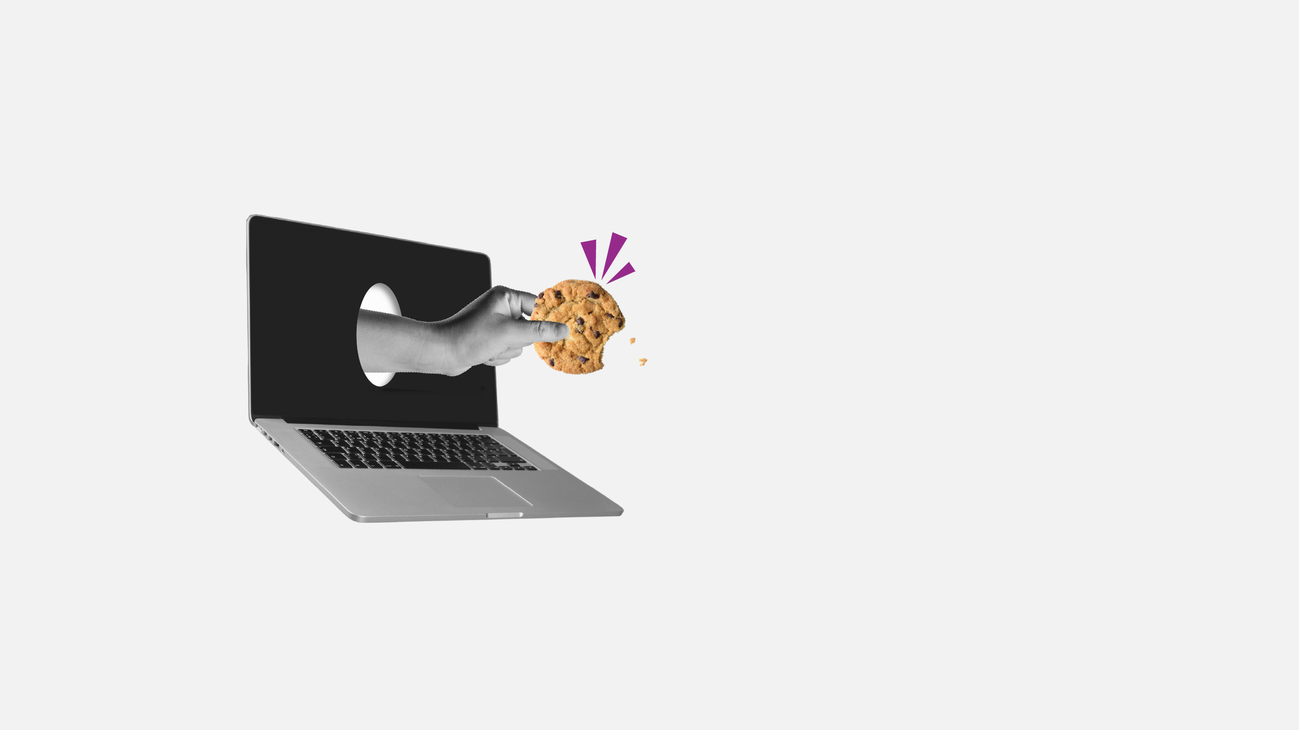 A hand coming out of a laptop, holding a cookie.
