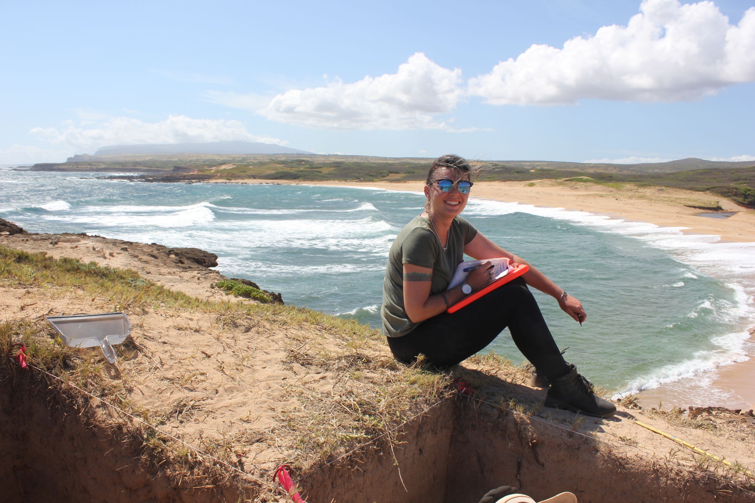 Georgie Wye recording the stratigraphic information for one of the excavation pits.